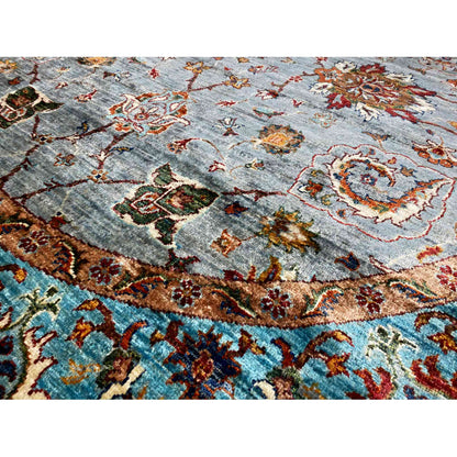 Carpet detail: gray pile with colorful ornaments, a golden-brown frieze and turquoise border