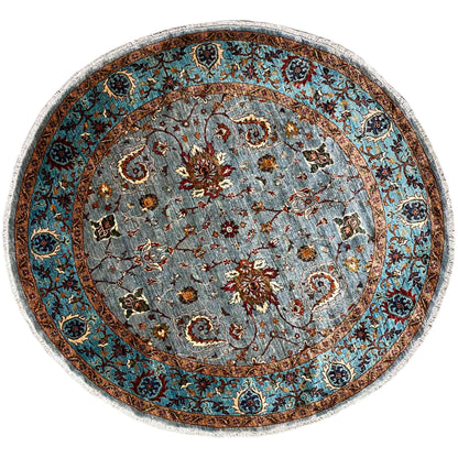 Round wool rug with a blue-gray ornamental pattern and brown border, 207x205 cm