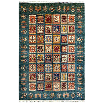 Blue-green rug with a central square patchwork design and border trim, multicolored, white fringed edge