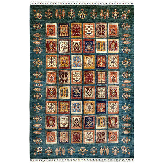 Blue-green rug with a central square patchwork design and border trim, multicolored, white fringed edge