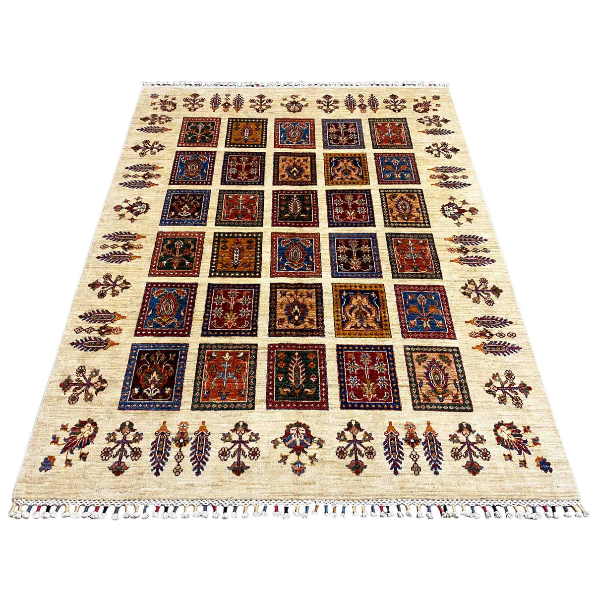 Rug with a cream-colored base, square pattern in blue, red, and brown, fringes