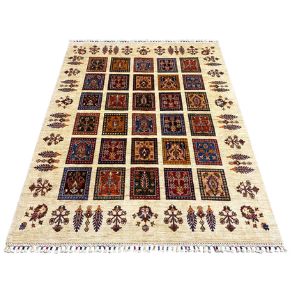 Rug with a cream-colored base, square pattern in blue, red, and brown, fringes