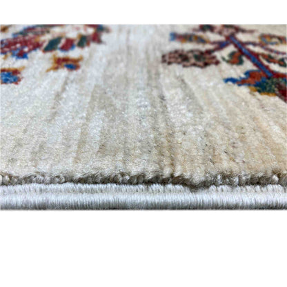 Rug edge with fringe and a dense pile on a cream-colored background