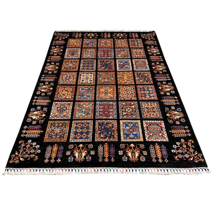 Wool rug with square patchwork designs in blue, red, and brown on a black background