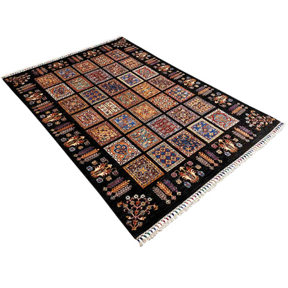 Wool rug with ornamental tile motifs and a black background, diagonal view
