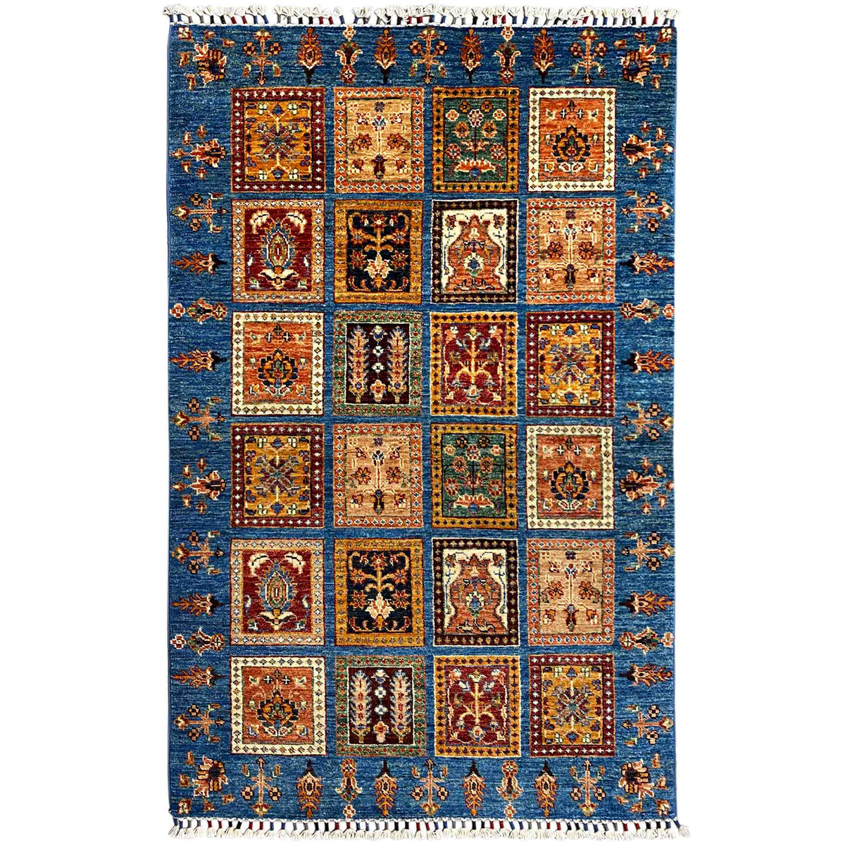Khorjin rug with a geometric patchwork pattern in blue, orange, and green, with fringes