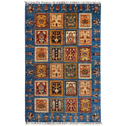 Khorjin rug with a geometric patchwork pattern in blue, orange, and green, with fringes