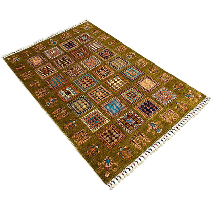 Khorjin rug in olive green with a diagonal view, colorful squares, and fringes