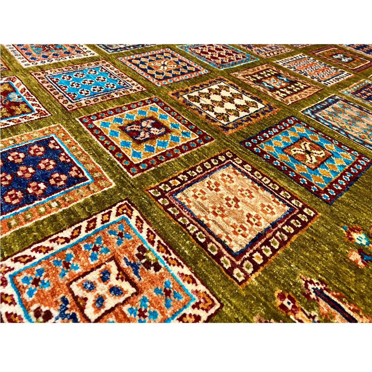 Khorjin rug in olive green with a detailed pattern of colorful squares