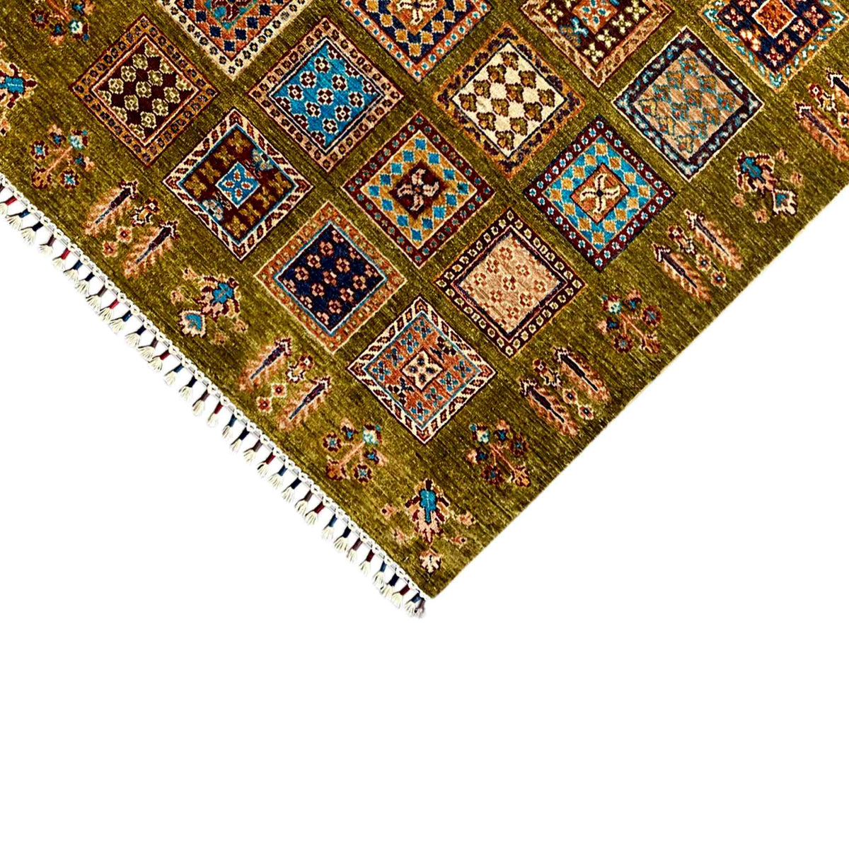 Khorjin rug corner in olive green with colorful squares and fringed trim