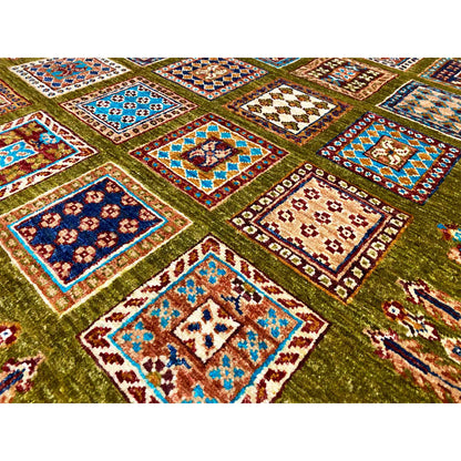 Detail of the olive-green wool rug: colorful squares with decorative edges