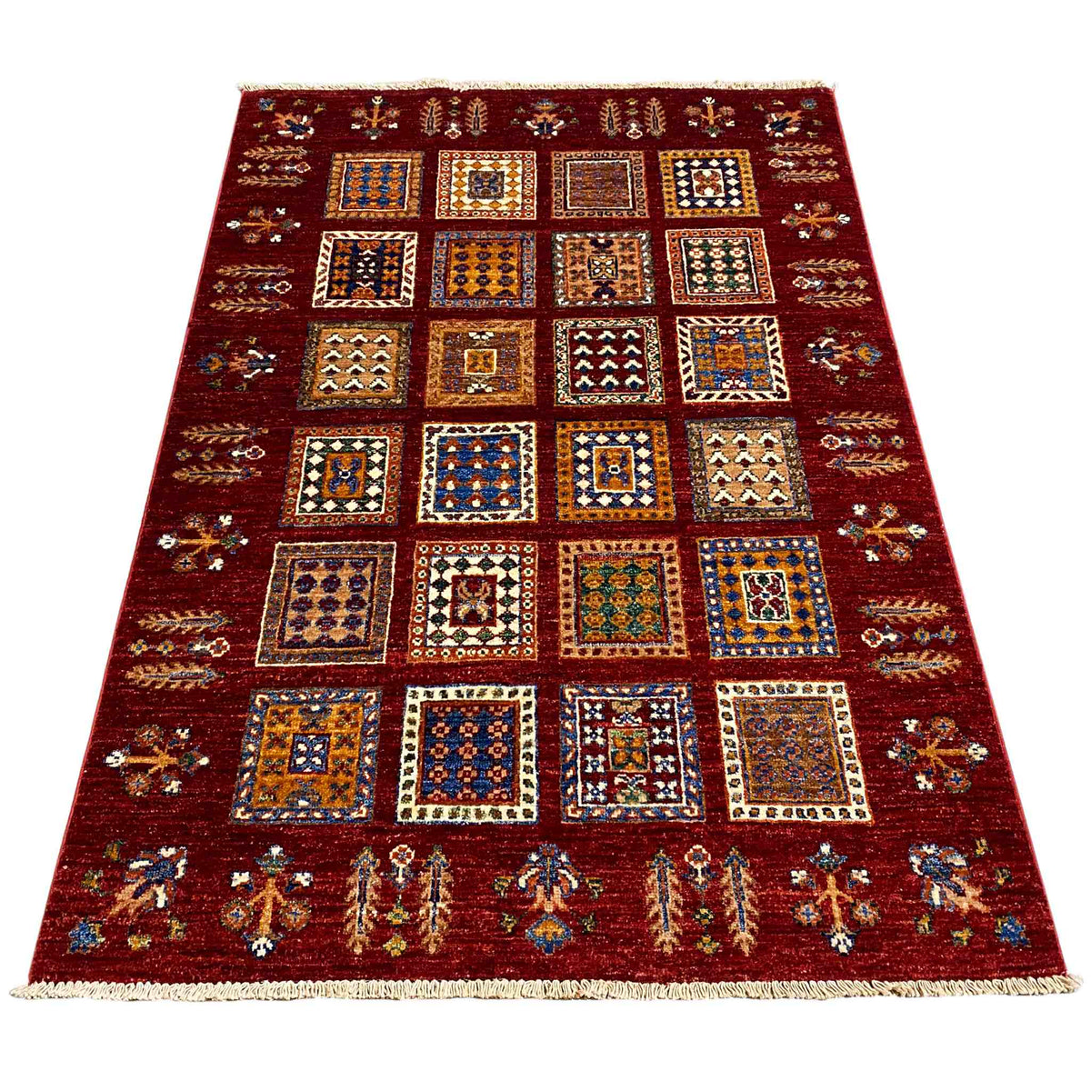 Afghan Khorjin wool rug, deep red, shown wide with a tile pattern and border.