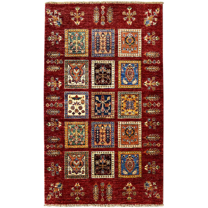 Deep red wool rug with Khorjin medallions and a geometric border with an all-over pattern