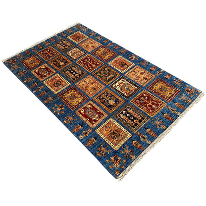 Blue Khorjin rug with a square ornamental pattern and decorative border