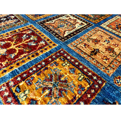 Close-up of the pattern: blue fields with golden-brown and red square ornaments