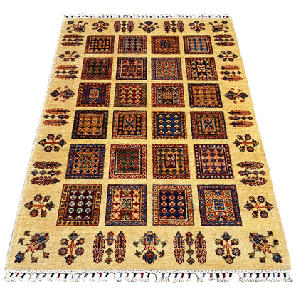 Beige Afghan Khorjin rug with a geometric tile pattern and colorful border ornaments, fringes
