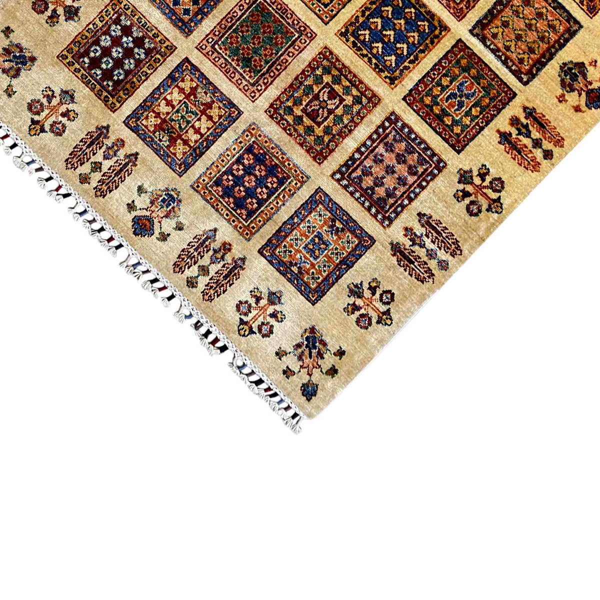 Corner view of Afghan Khorjin rug: beige ornamental lattice with colorful medallions and fringes