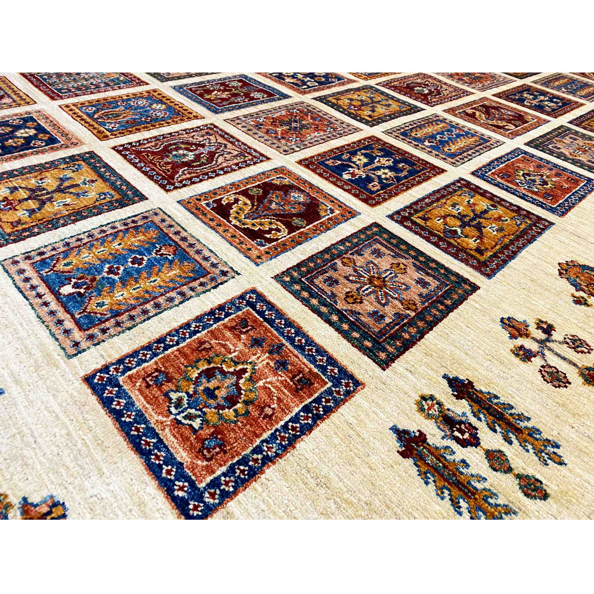 Detailed view: beige carpet with blue, red, and yellow tiles in a grid