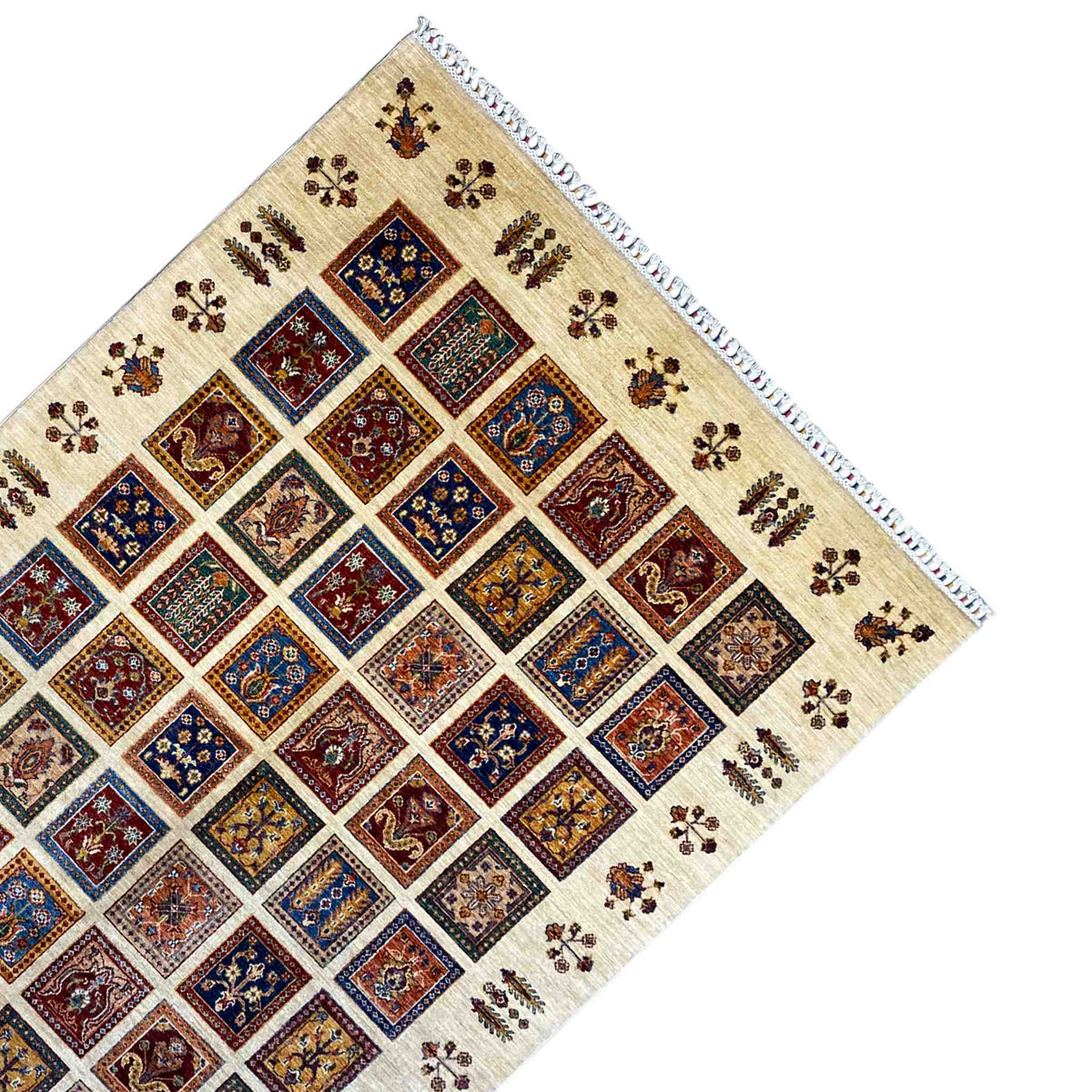 Beige rug with diagonal diamonds, colorful floral ornaments, and decorative fringes