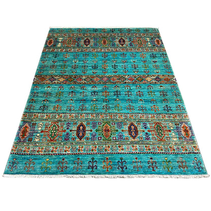 Rectangular rug in petrol blue with broad ornamental bands and colorful details