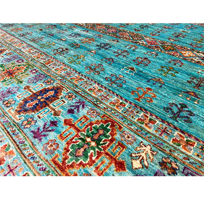 Carpet detail in petrol blue with ornamental friezes, colorful cross and floral motifs