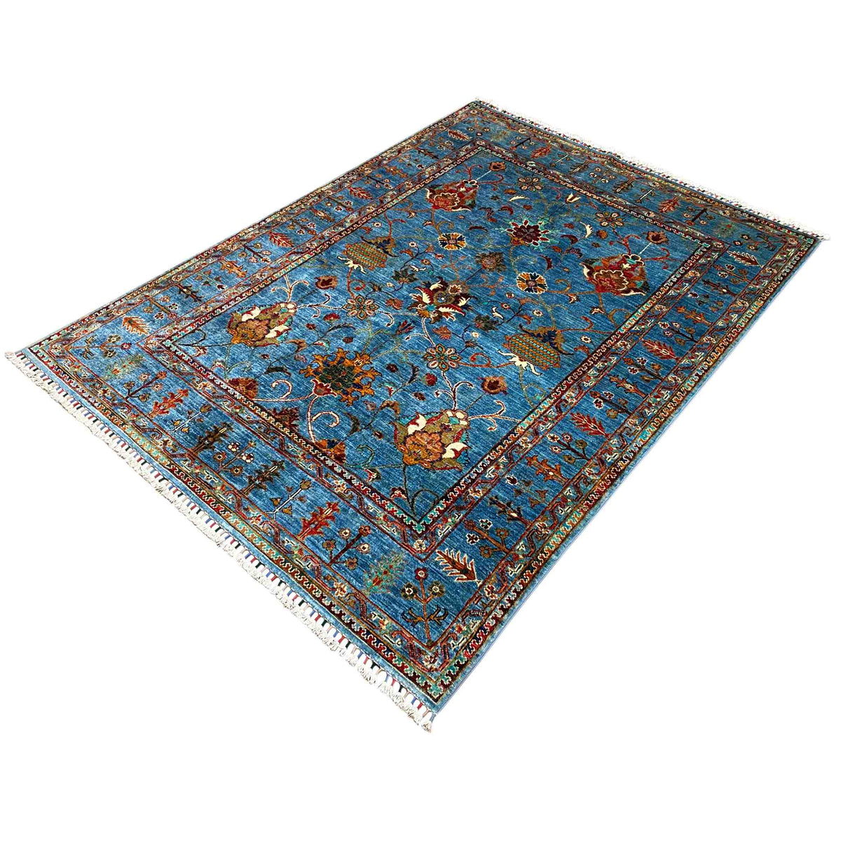 Afghan Khorjin rug, blue, floral pattern, fringes visible along the edges