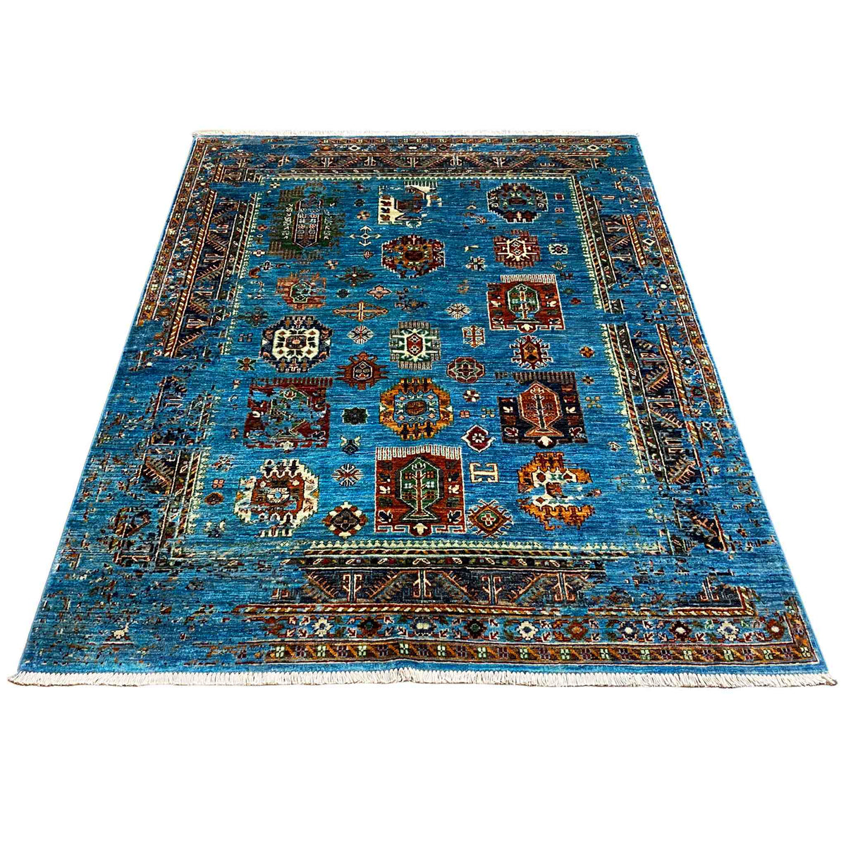 Rectangular blue rug with colorful tile patterns and a surrounding border