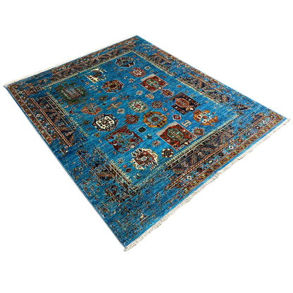 Blue Khorjin rug with multicolored medallions, shown diagonally, rectangular