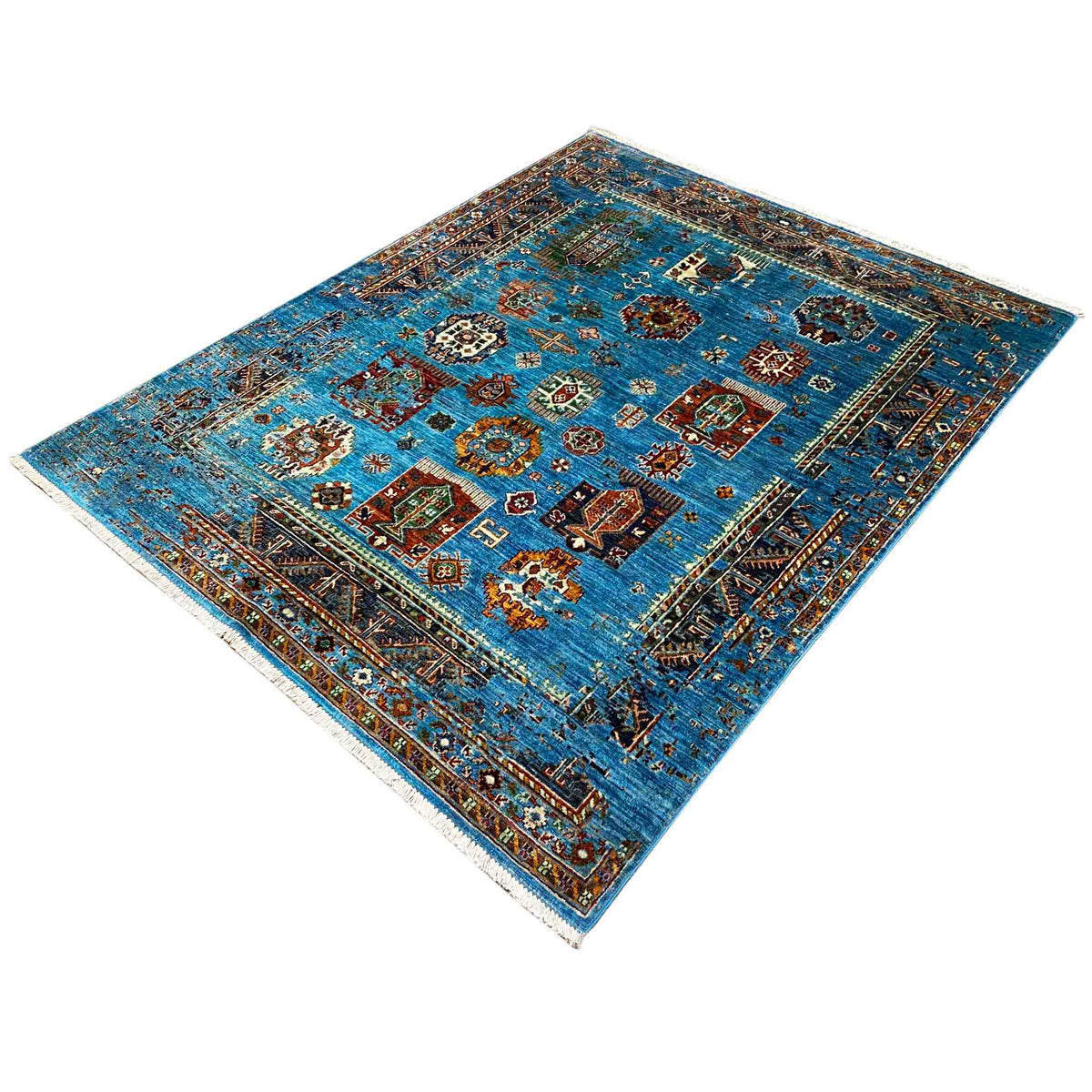 Blue rug with colorful patterned panels, a continuous border, and short fringe along the edge