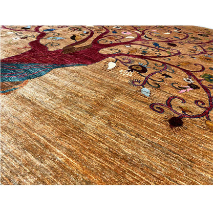 Close-up of carpet: tree and floral ornaments on beige-brown, colorful details