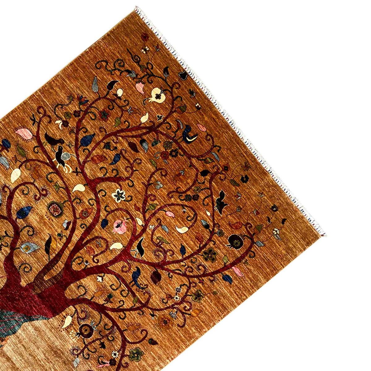 Corner view: Afghan Khorjin rug with tree motifs, fringe, and a finished edge