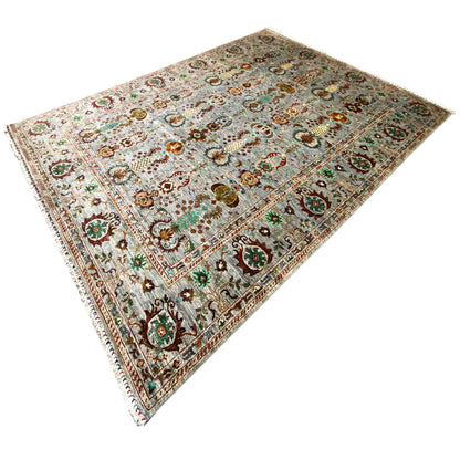 Oblique view of a gray rug with colorful ornamental medallions along the edge