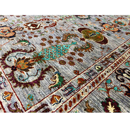 Close-up of the carpet surface: gray pile with colorful ornaments
