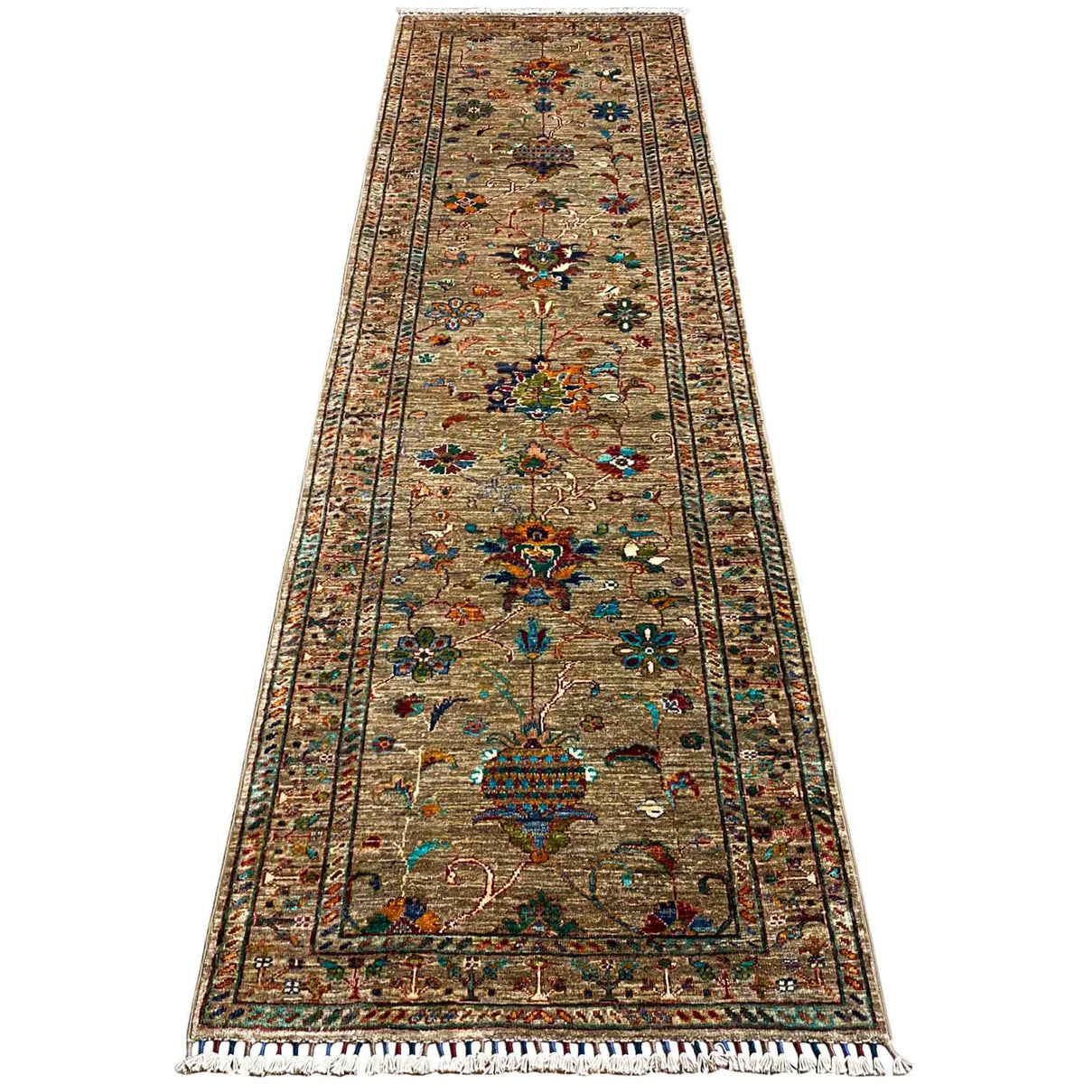 Runner rug with a narrow border design, brown background, and colorful floral motifs