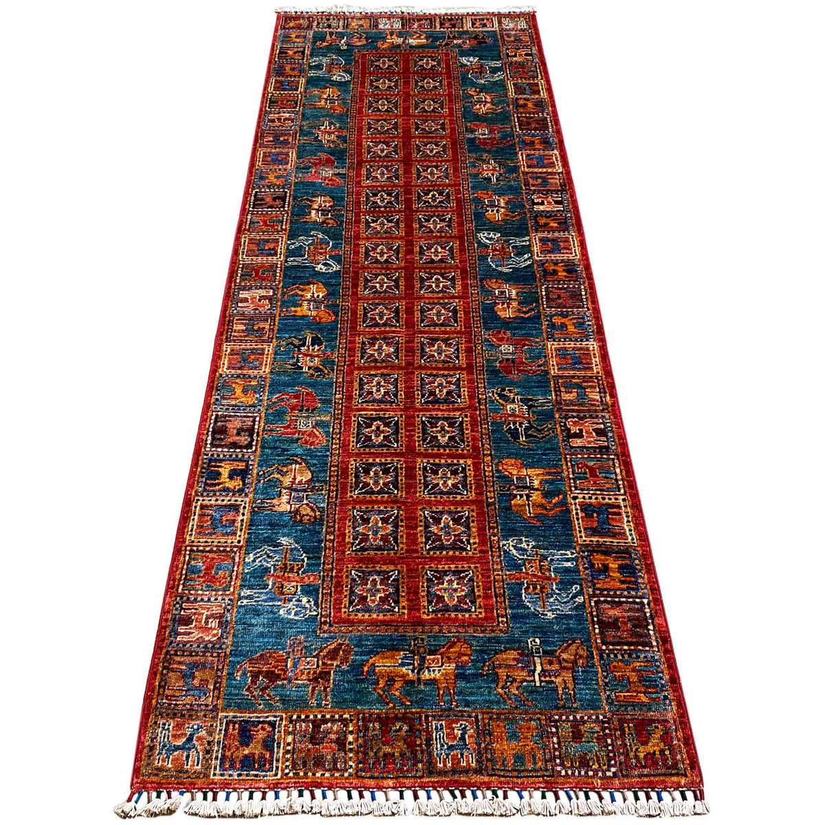 Runner rug with a blue background, red trim, and animal motifs, rectangular