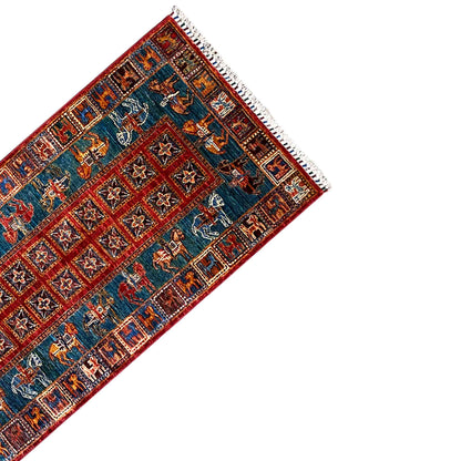 Rug corner with fringe, blue-red pattern with animal motifs in the border