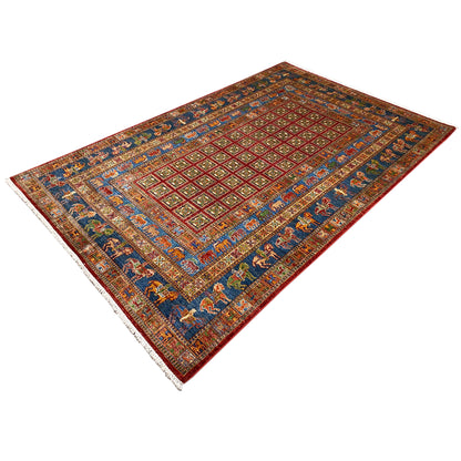Hand-knotted Khorjin rug, angled: geometric lattice pattern with animal motifs