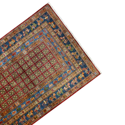 Hand-knotted Khorjin rug: corner view with diamond, checkered, and animal frieze patterns