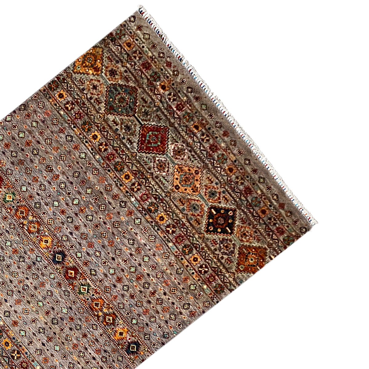Hand-knotted Khorjin rug, corner view with medallion pattern and decorative fringe along the edge.