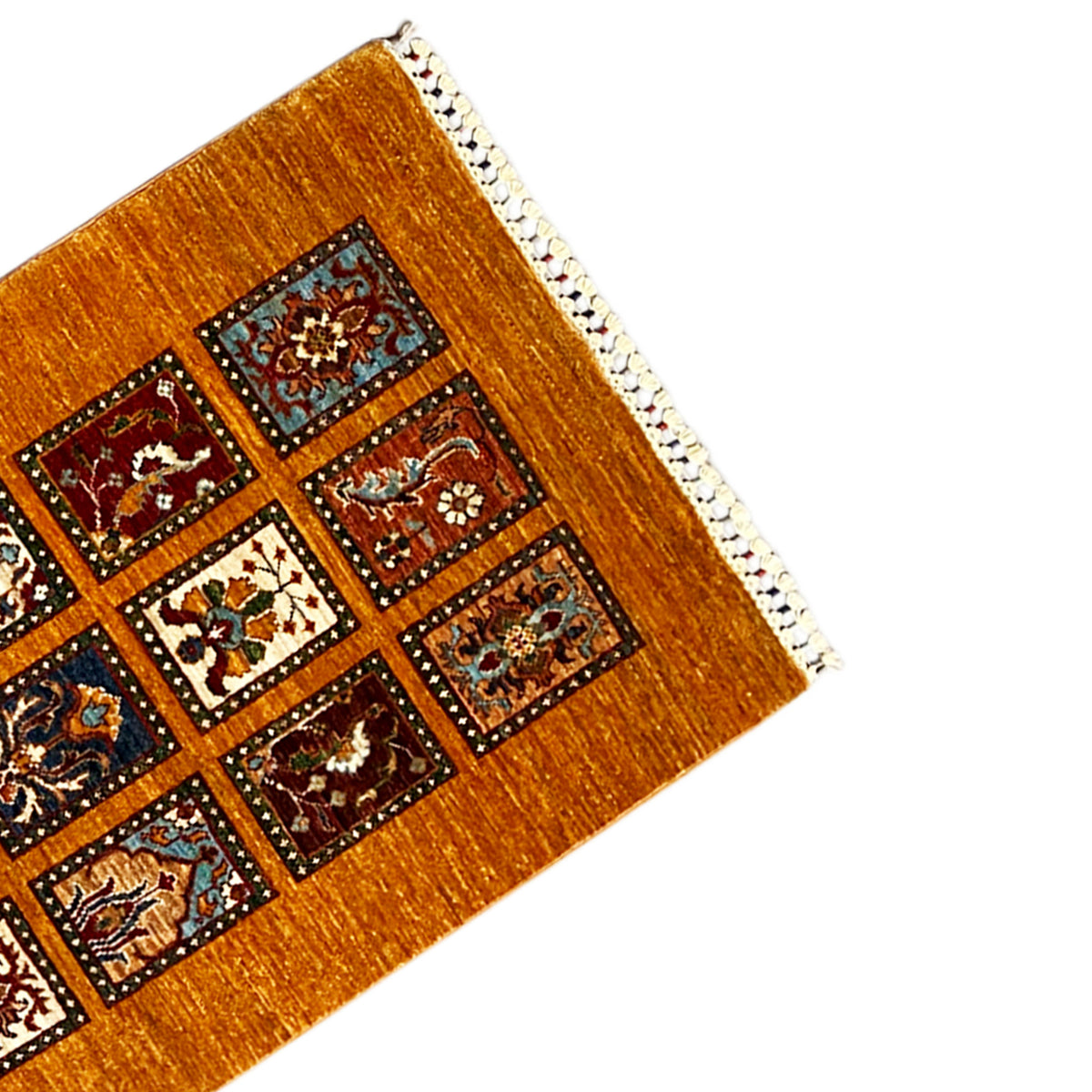 Runner corner, honey brown, with a tile pattern, white trim, and fringe
