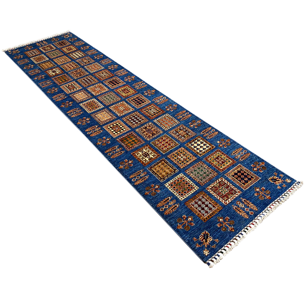 Khorjin runner in a diagonal cut, blue patchwork pattern with colorful details