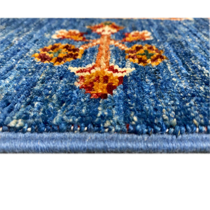 Khorjin runner floral detail in blue with an orange cross motif