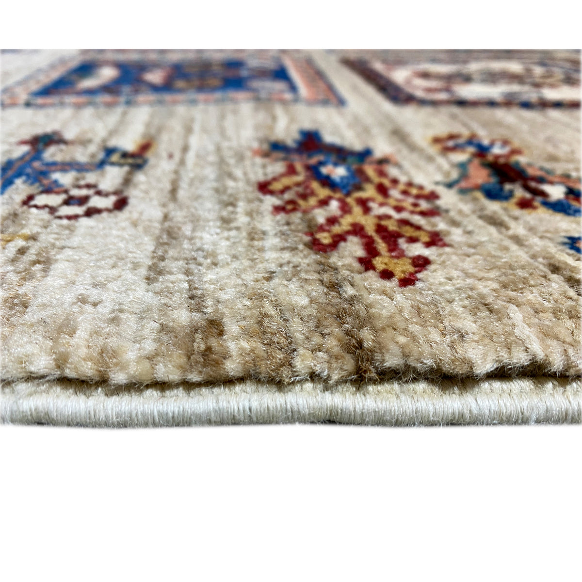 Close-up of a hand-knotted Khorjin runner: pile and woven edge in vibrant colors