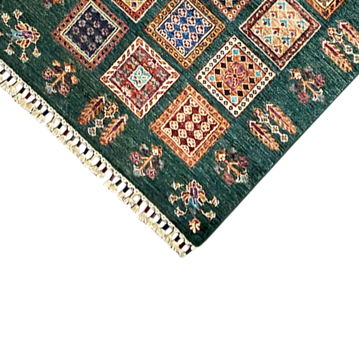 Khorjin runner detail at the hem: dark green with a square border and rows of fringe