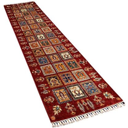 Khorjin runner with red panels, multicolored squares, and fringes along the edge.