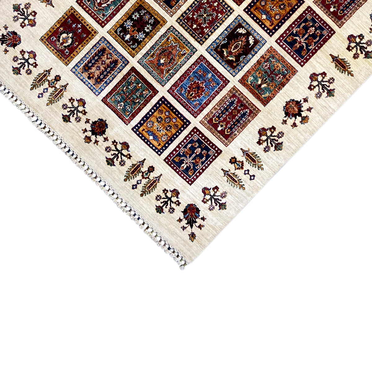 Khorjin rug corner view with border and fringes, multicolored tile motifs in the pattern.
