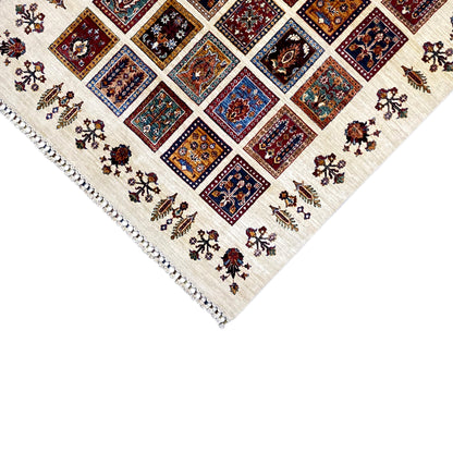 Khorjin rug corner view with border and fringes, multicolored tile motifs in the pattern.