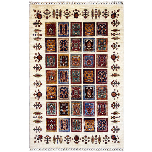 Hand-knotted Khorjin rug with square patchwork and a multicolored ornamental pattern.