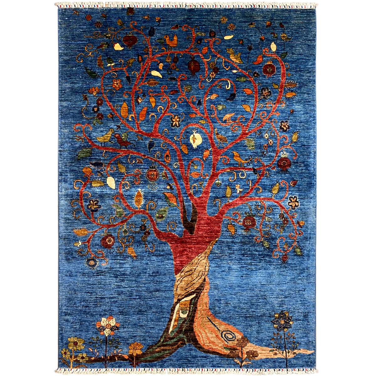 Hand-knotted rug with a blue background and a Tree of Life motif in red and orange, fringes