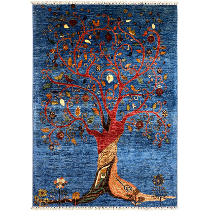 Hand-knotted rug with a blue background and a Tree of Life motif in red and orange, fringes